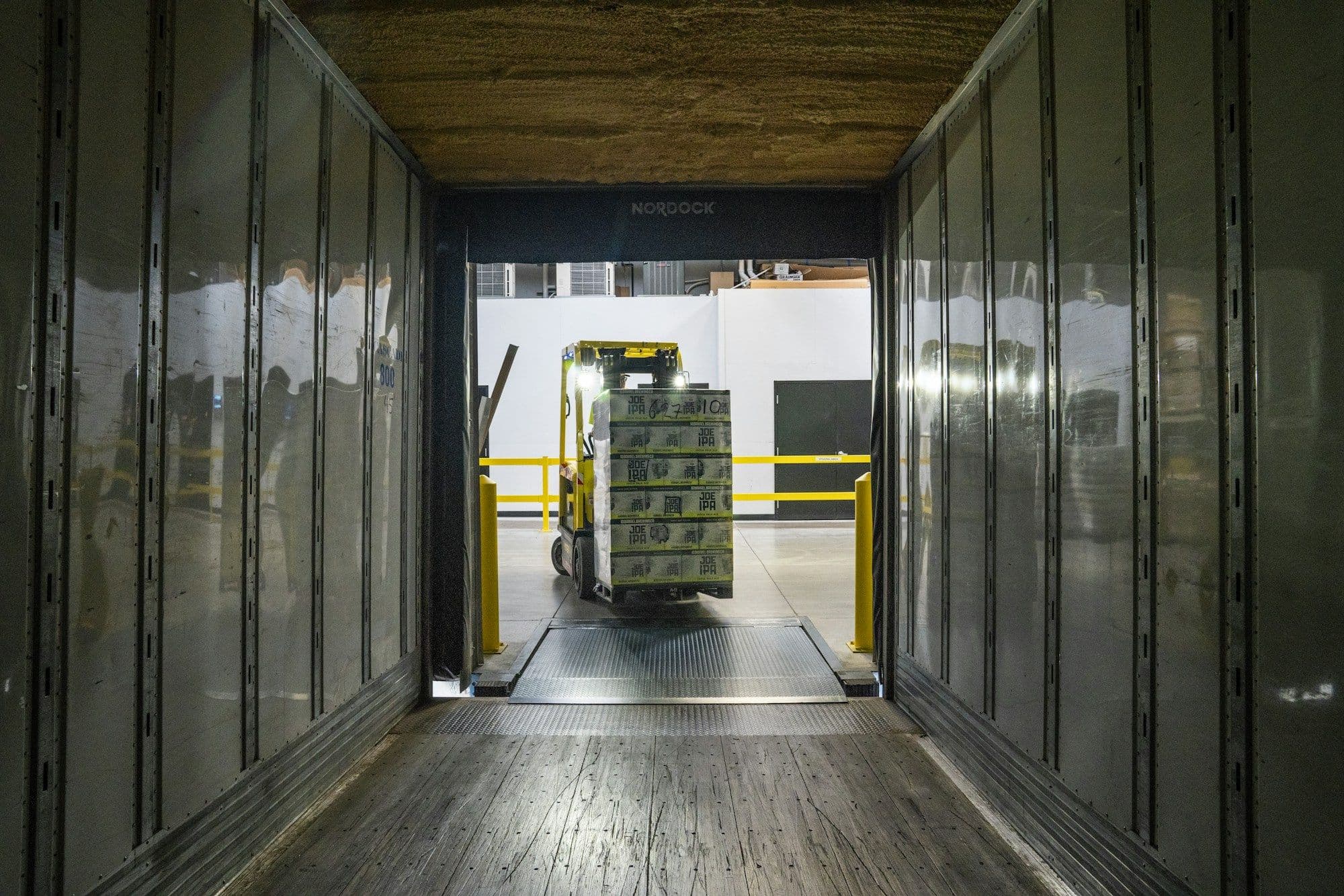 Pallet being loaded into a trailer at a distribution dock